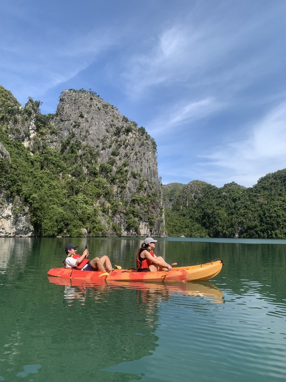 Kayakers paddling through Lan Ha Bay